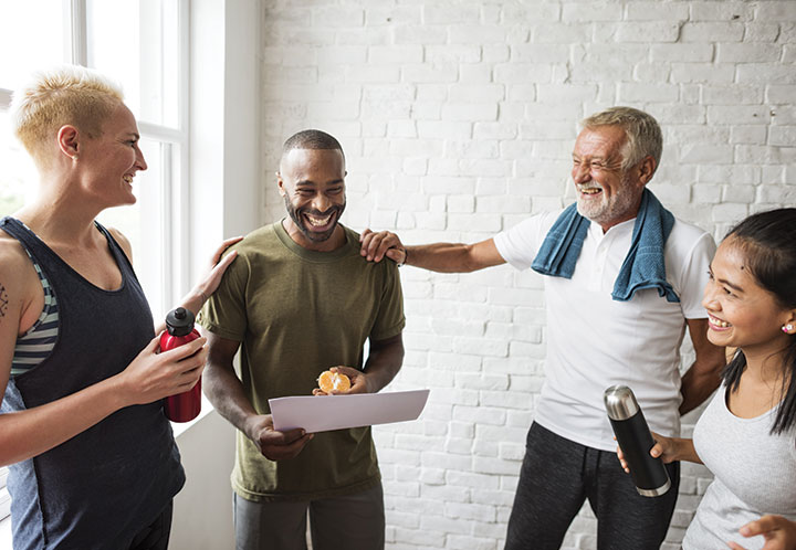 members of a fitness class laughing