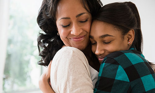 Mother and Daughter Hugging