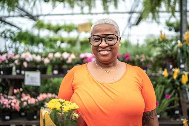 woman smiling at flower shop