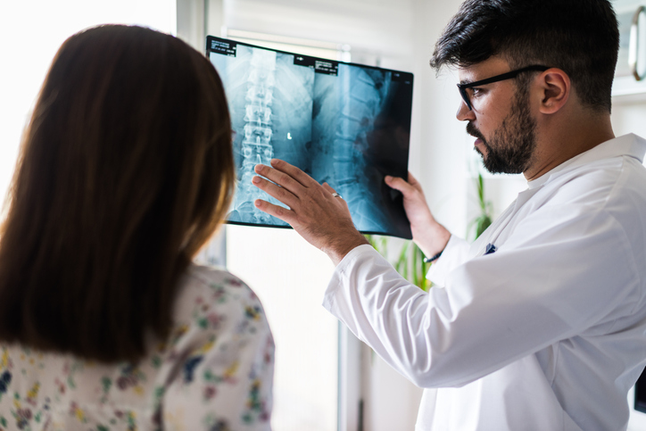 Mount Carmel spine care specialist consulting with patient about back pain treatment